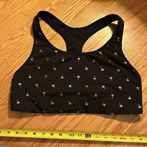Gently used black sports bra w/ gold palm trees